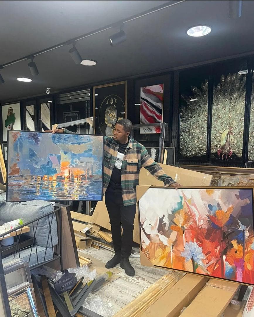 NURALUXURYART gallery setting with hand-painted artworks and framed pieces